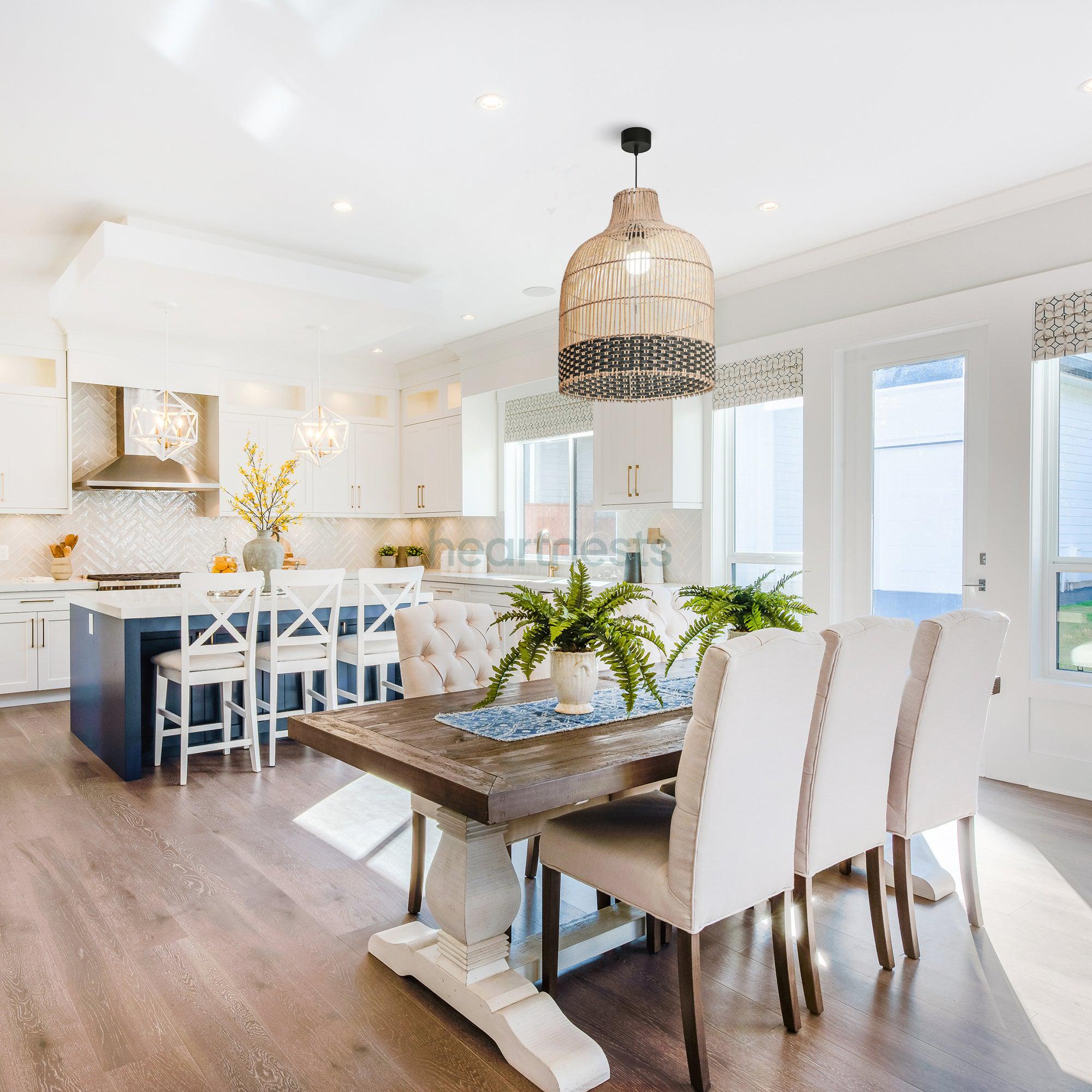 Heartnests's Ayla rattan hanging light is hung above a dining table with 6 dining chairs in a large living room with 3 window and wooden floor, inspired by contemporary decor style