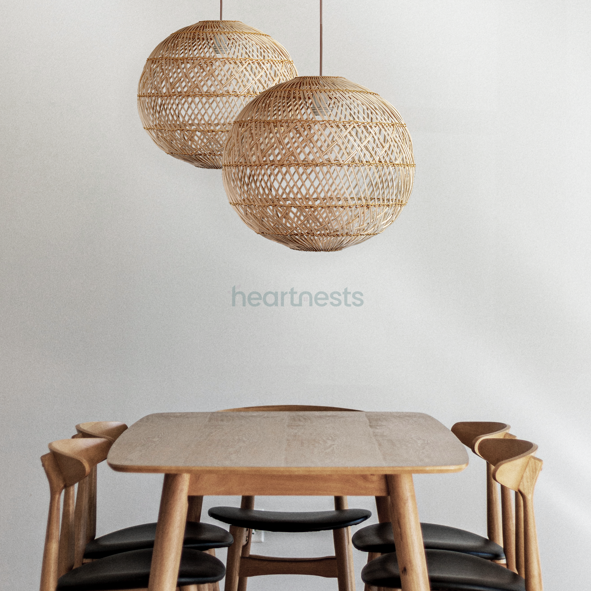 2 Ballia round shape wicker hanging lights are hung above a round wooden table