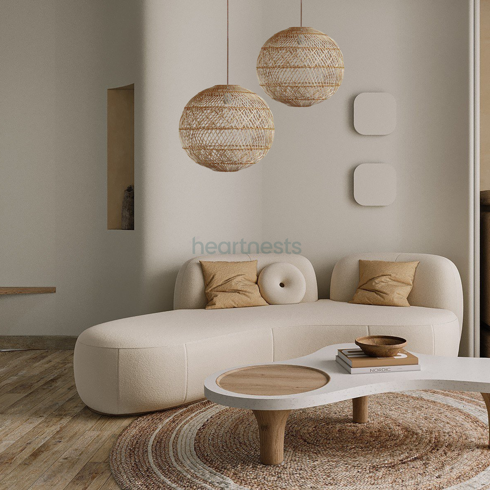 2 Ballia round shape wicker hanging lights are hung above a boucle sofa in mid century chic decor style living room