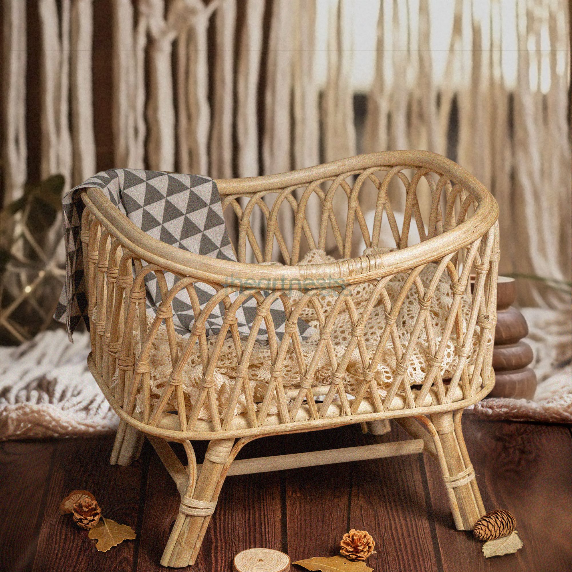Heartnests's Cra Baby Prop for baby photography on a wooden floor and its background is a white macrame