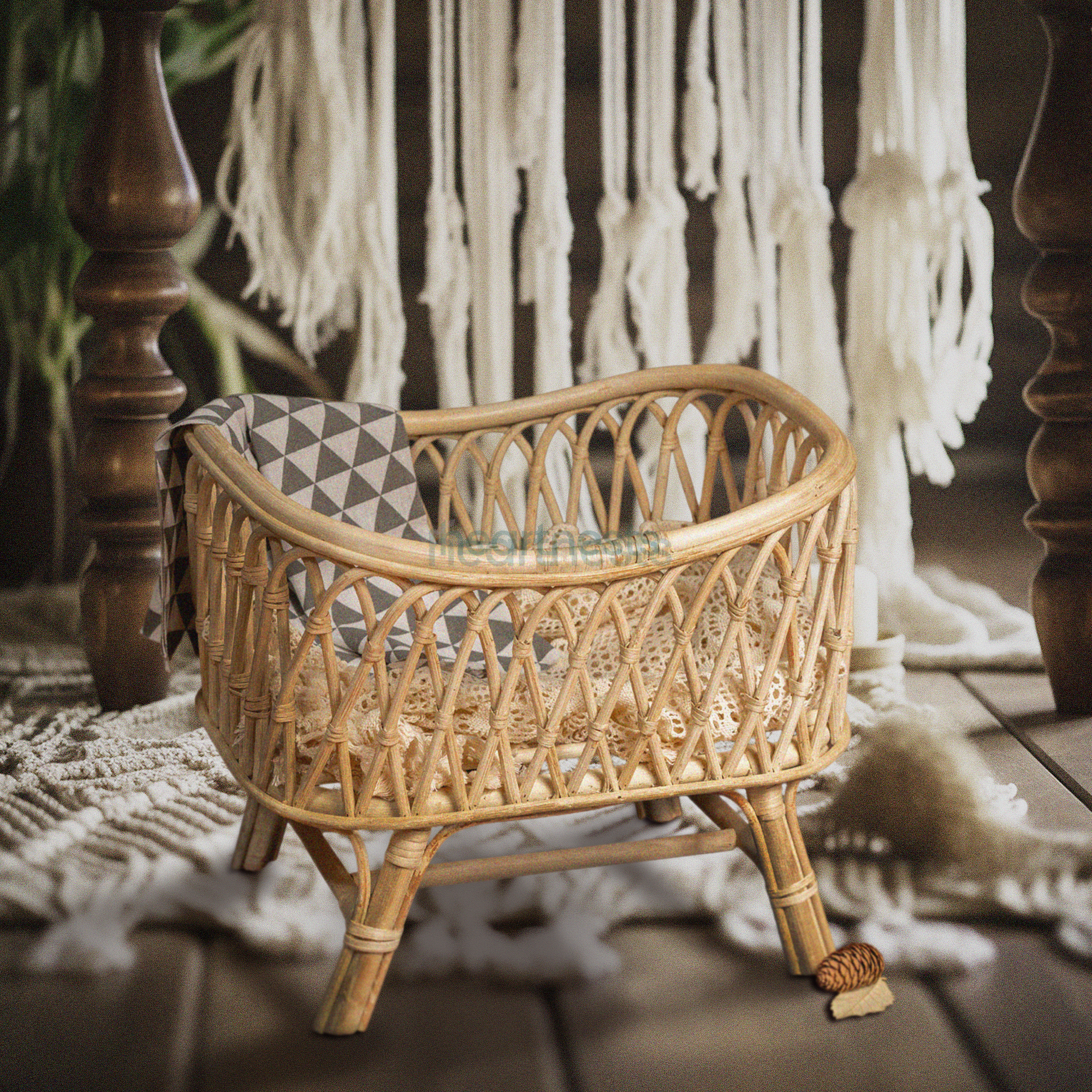 Heartnests's Cra Baby Prop on a rustic color wooden floor and its background is a white macrame