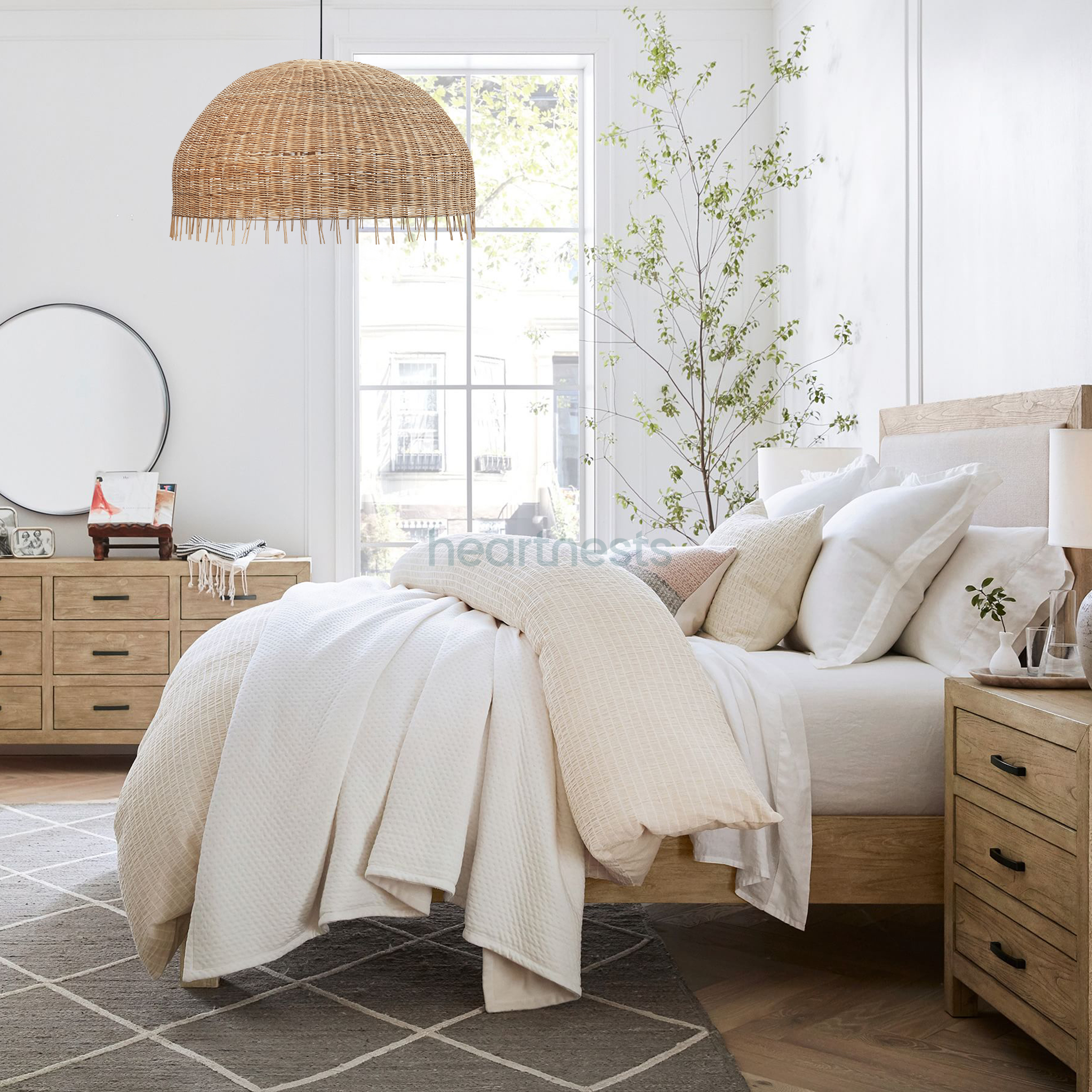 A Heartnests's Daria Wicker Hanging Light is hung above a wooden bed in a contemporary farmhouse bedroom decor setting