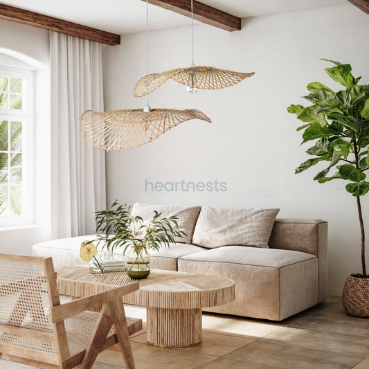 2 of Heartnests' Hakea Bamboo Pendant Lights are hung above a 2 seater gray color lounge and a wooden table stool in a farmhouse decor style living room