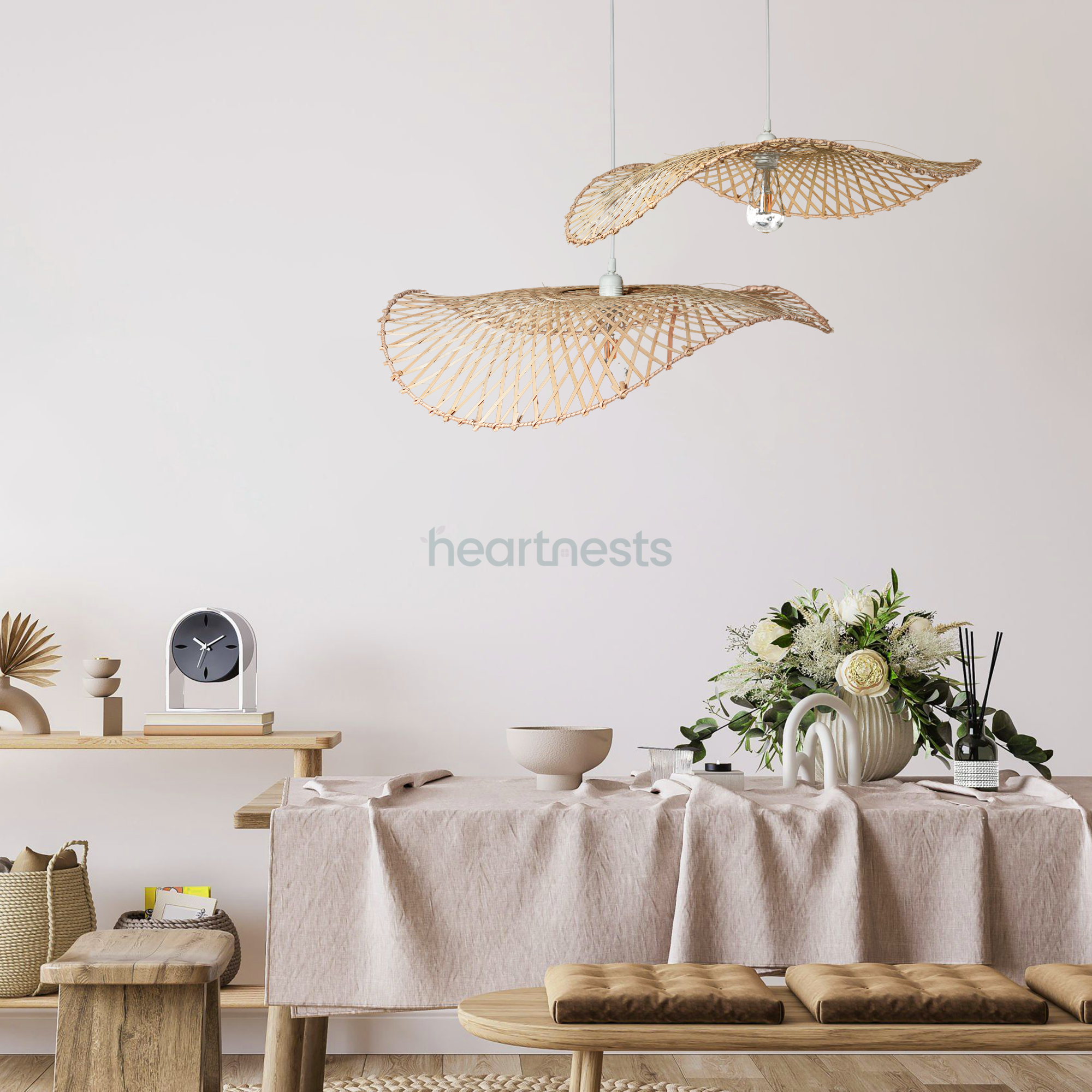 2 of Heartnests' Hakea Wicker Hanging Lights are hung above a console table in a hallway