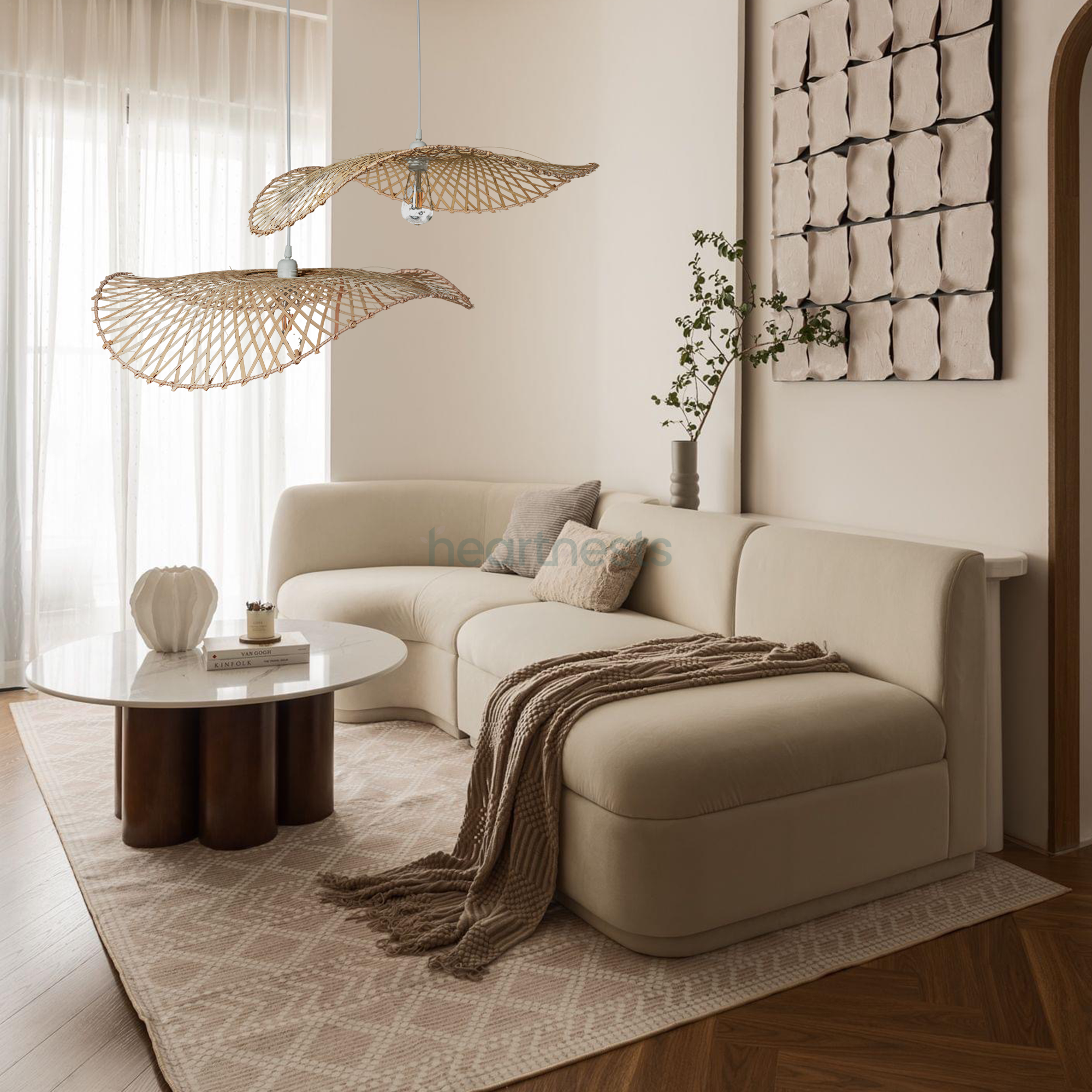 2 of Heartnests' Hakea Rattan Hanging Lights are hung above a gray color lounge in a Scandinavian decor style living room