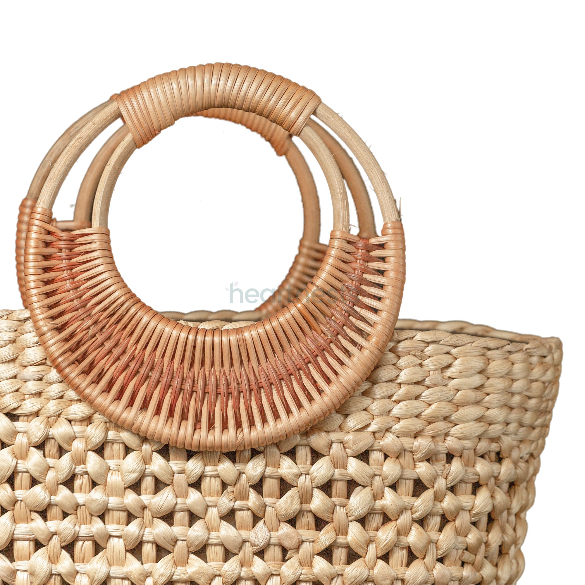 A zoomed in handle part of Heartnests' Lafi Wicker Fashion Bag is on white background