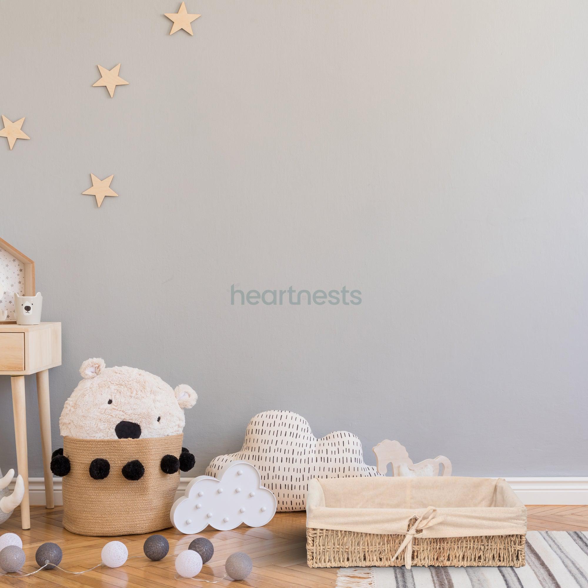 A Heartnests' Mimi Seagrass Organiser is on wooden floor of a nursery