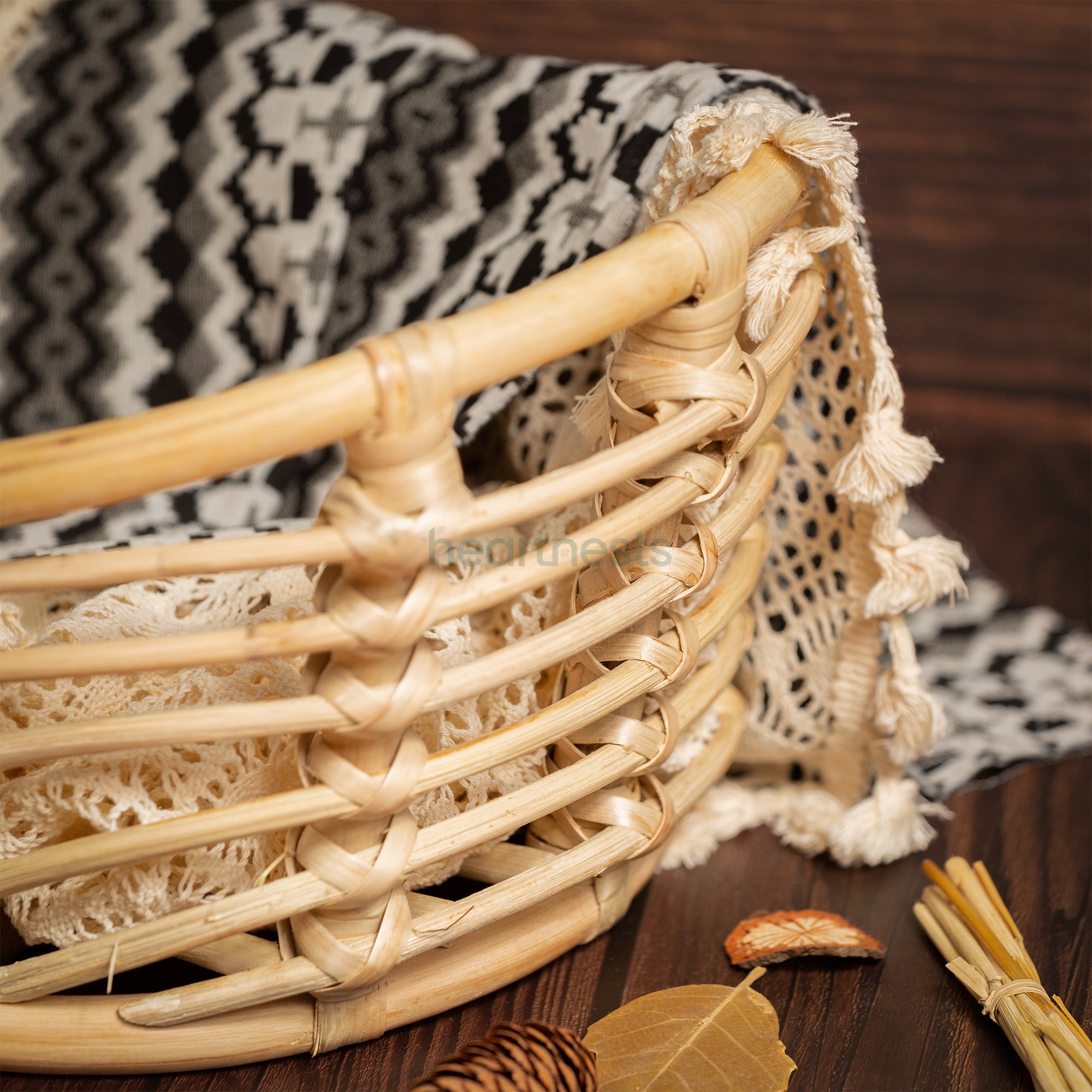 A part of a Heartnests's Noah Rattan Baby Prop is seen in a close view
