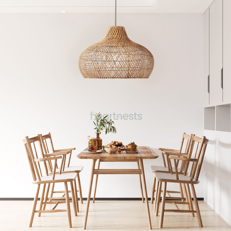 A Heartnests's Fraser Bamboo Pendant Light is a centrepiece hung above a set of wooden living room table and 4 wooden chairs in a boho decor style dining room