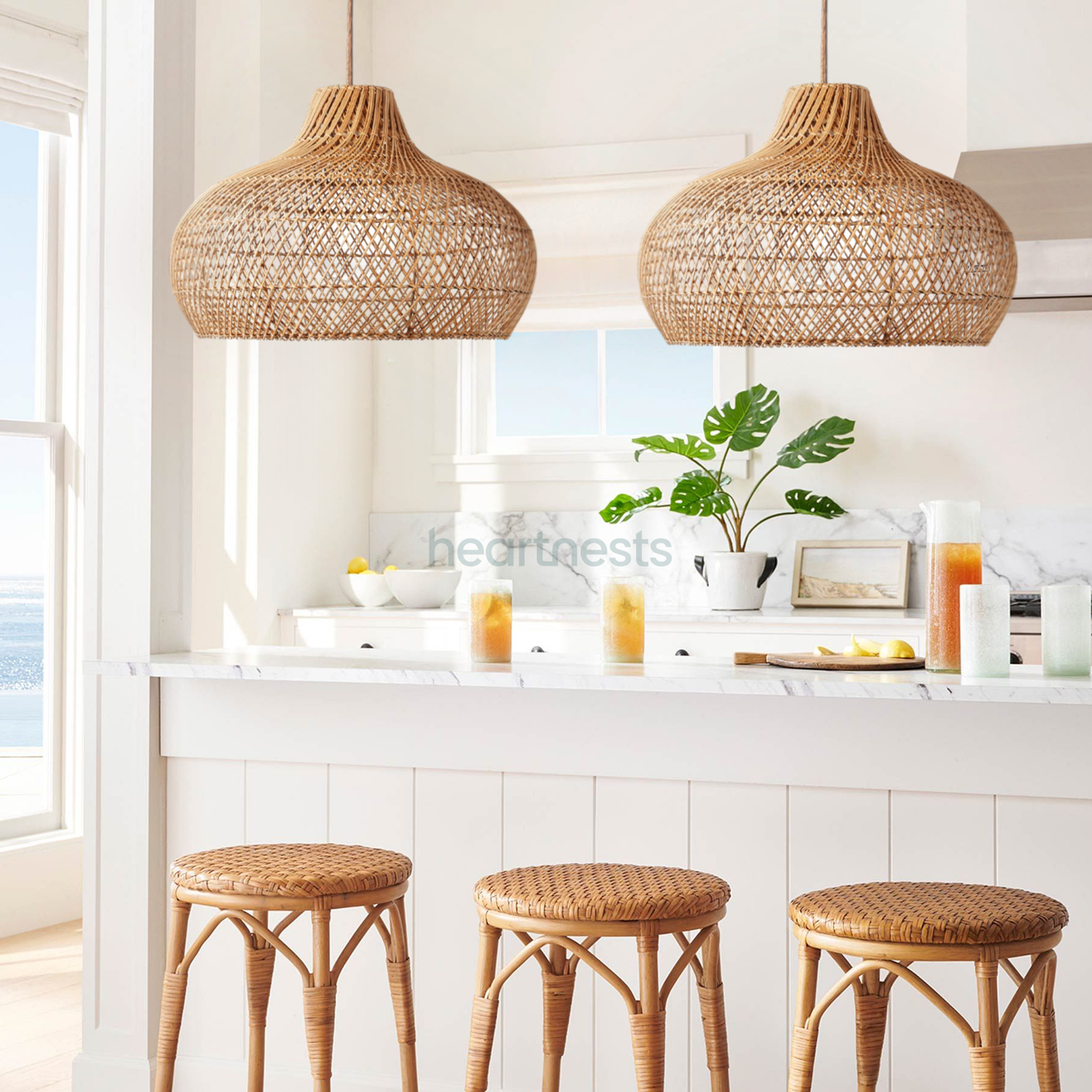 2 of Heartnests's Fraser Rattan Pendant Lights are hung above a minimalistic white kitchen island and 3 rattan kitchen stools following minimalistic contemporary decor style