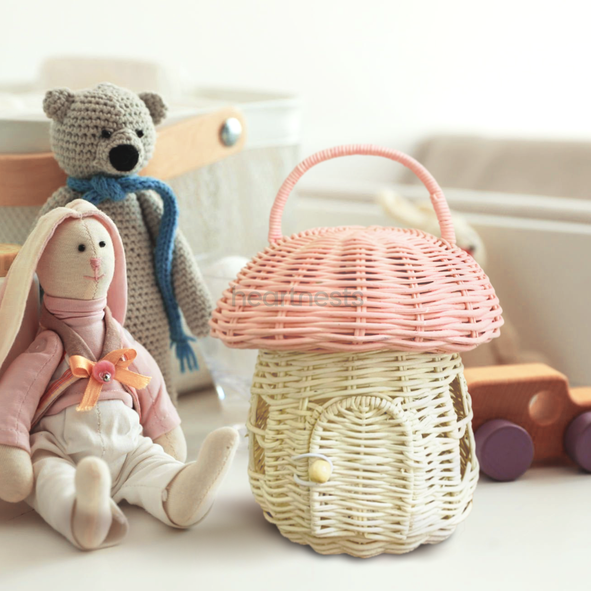 Heartnests' Pinky Rattan Mushroom is placed next to a teddy bear