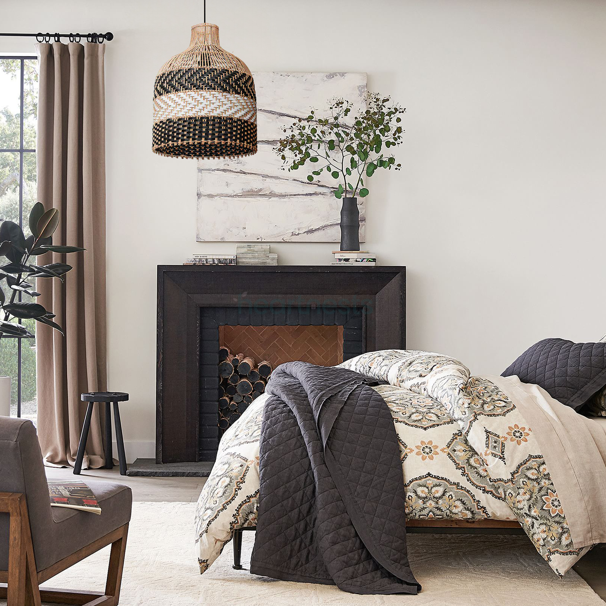 A Heartnests' Luka Wicker Pendant Light is hung above a bed and a wooden armchair in a bedroom