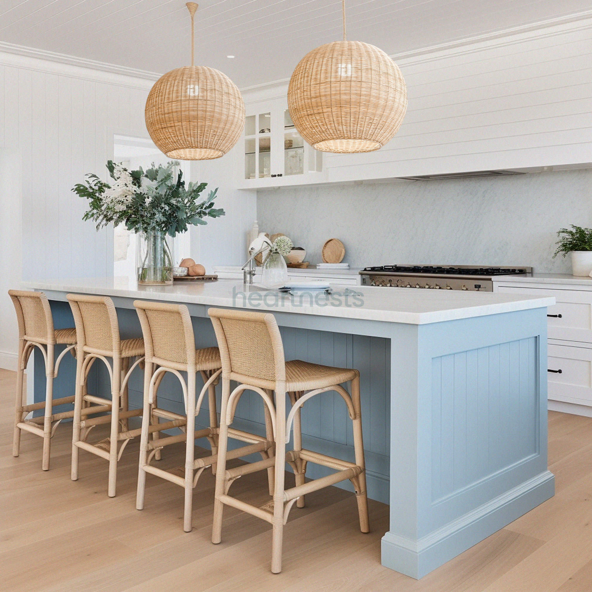 2 of Heartnests' Preethy Rattan Hanging Lights and hung above a kitchen island with blue hues and 4 rattan chairs
