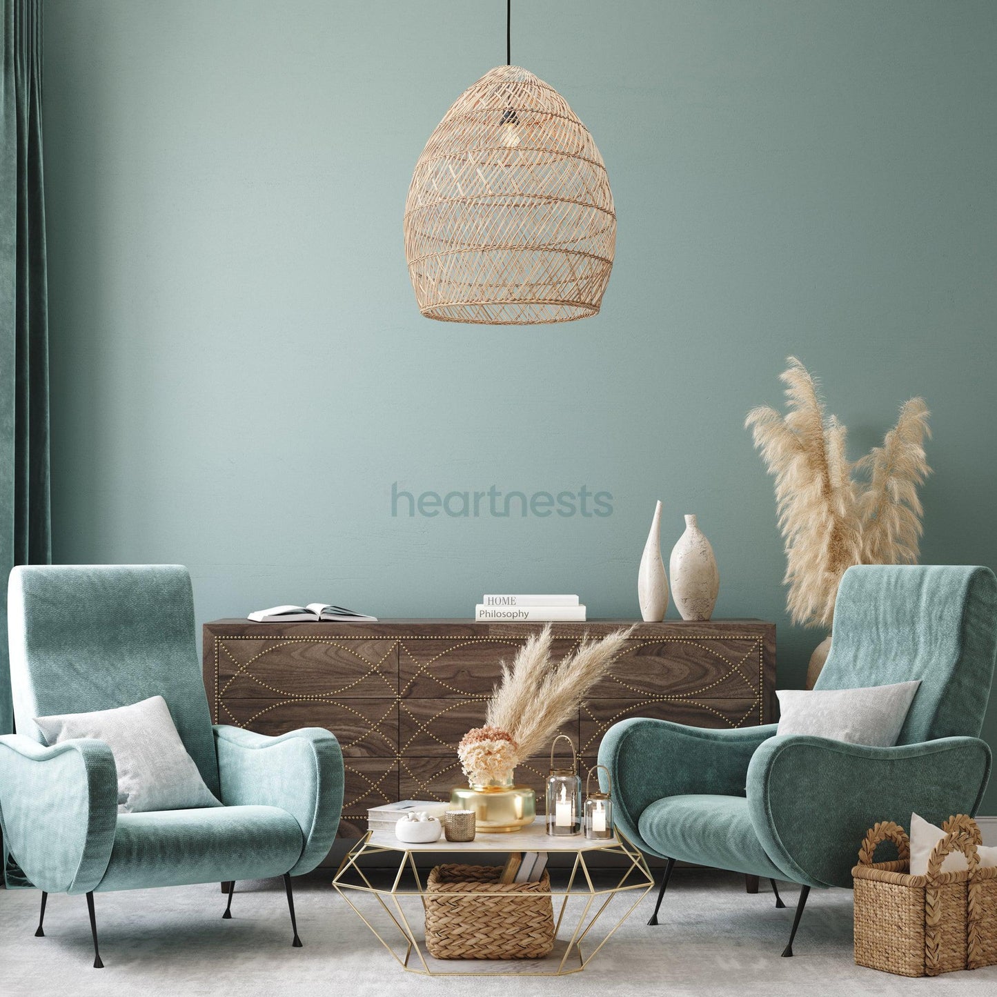 A Brighton Rattan Pendant Light is hung in a living room setting, above a living room table and 2 art deco style chairs