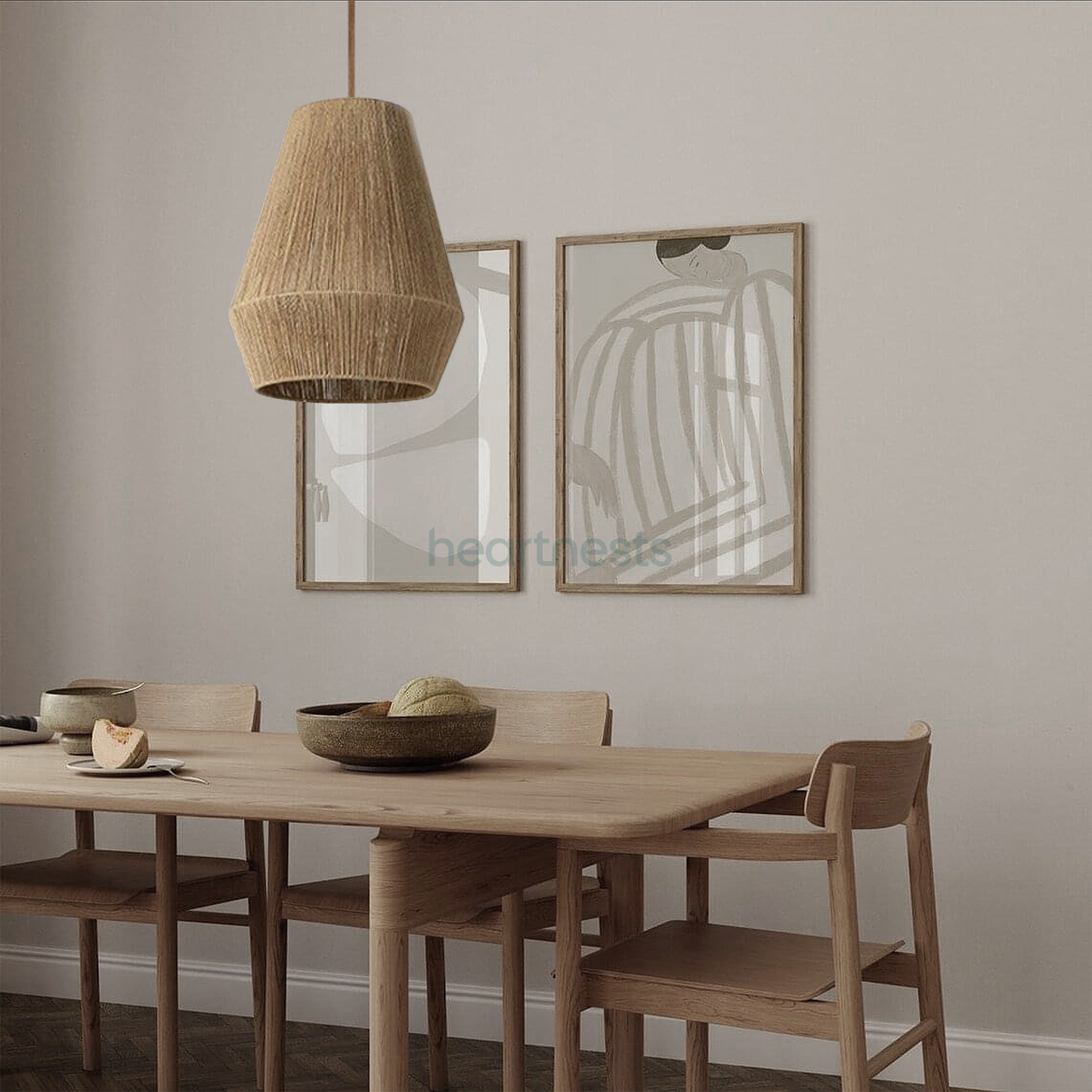 A Heartnests's Long Diamond Jute Hanging Light is hung above a wooden dining room table in a minimalistic dining room setting