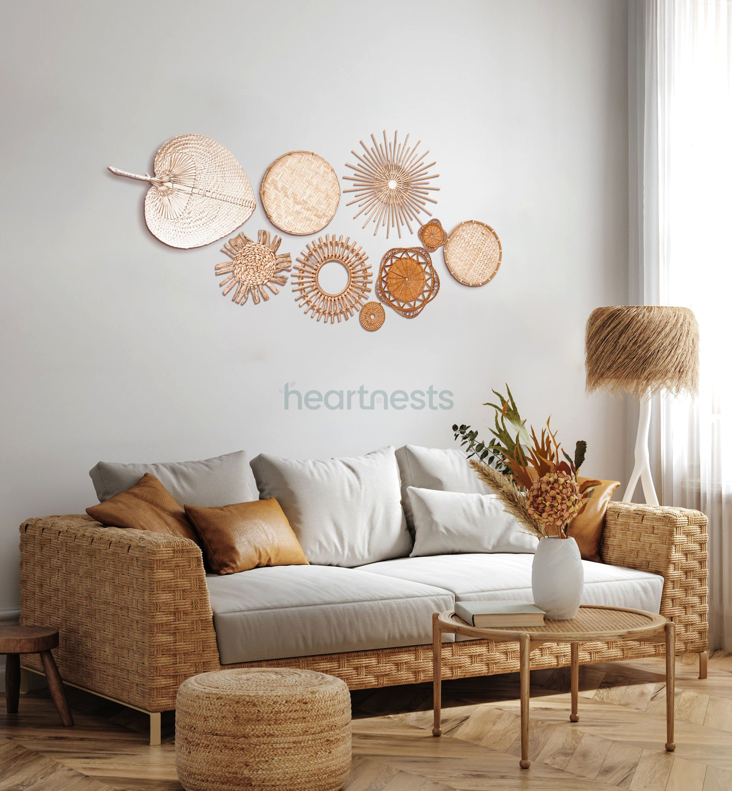 A Heartnests' set of 9 Freiya rattan and seagrass wall decor is hung above a 3 seater gray color lounge next to a brown color floor lamp