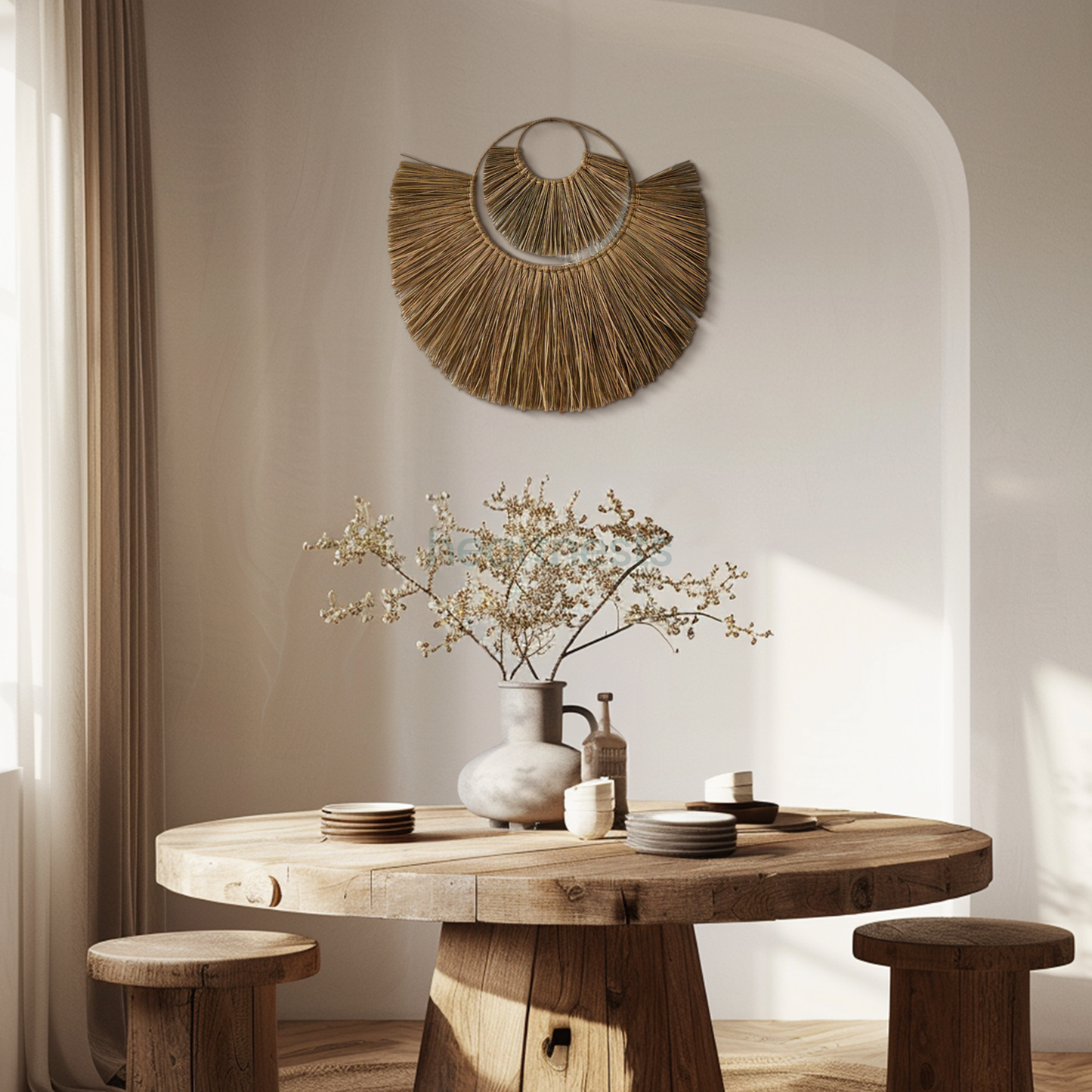 Heartnests' Moon Seagrass Wall Decor in size Large and Small are hung on a wall with curved edges above a wooden round table with a terra cotta flower vase and 2 wooden chair in a Wabi Sabi style living room