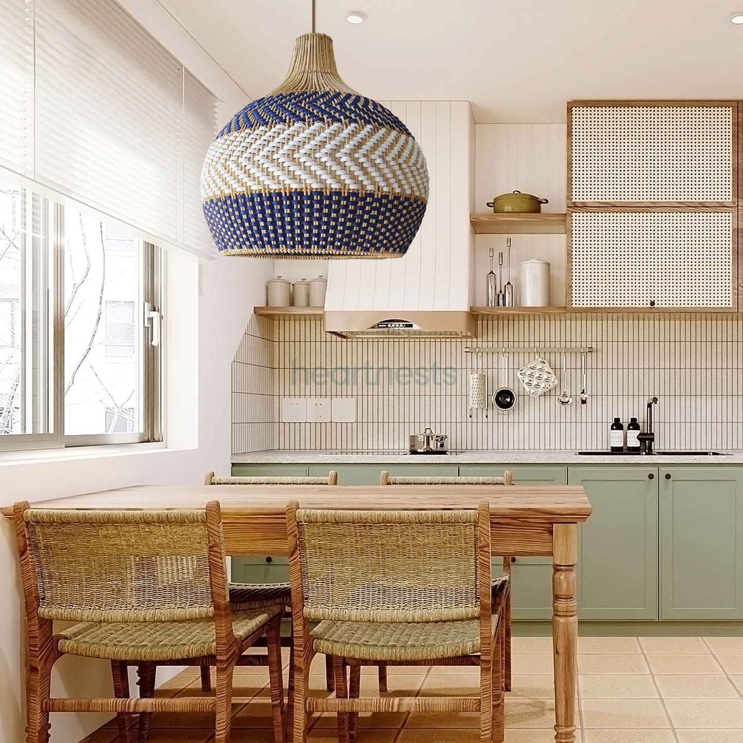 A Heartnests' Cosmo rattan pendant light is hung above a dining room table in a boho style kitchen