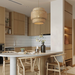 Illia bamboo pendant light is hung in kitchen, above a wooden dining table, inspired by modern boho style