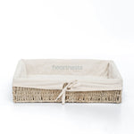 A Heartnests' Mimi Seagrass Storage Basket in rectangular shape with cotton beige color liner is on white background