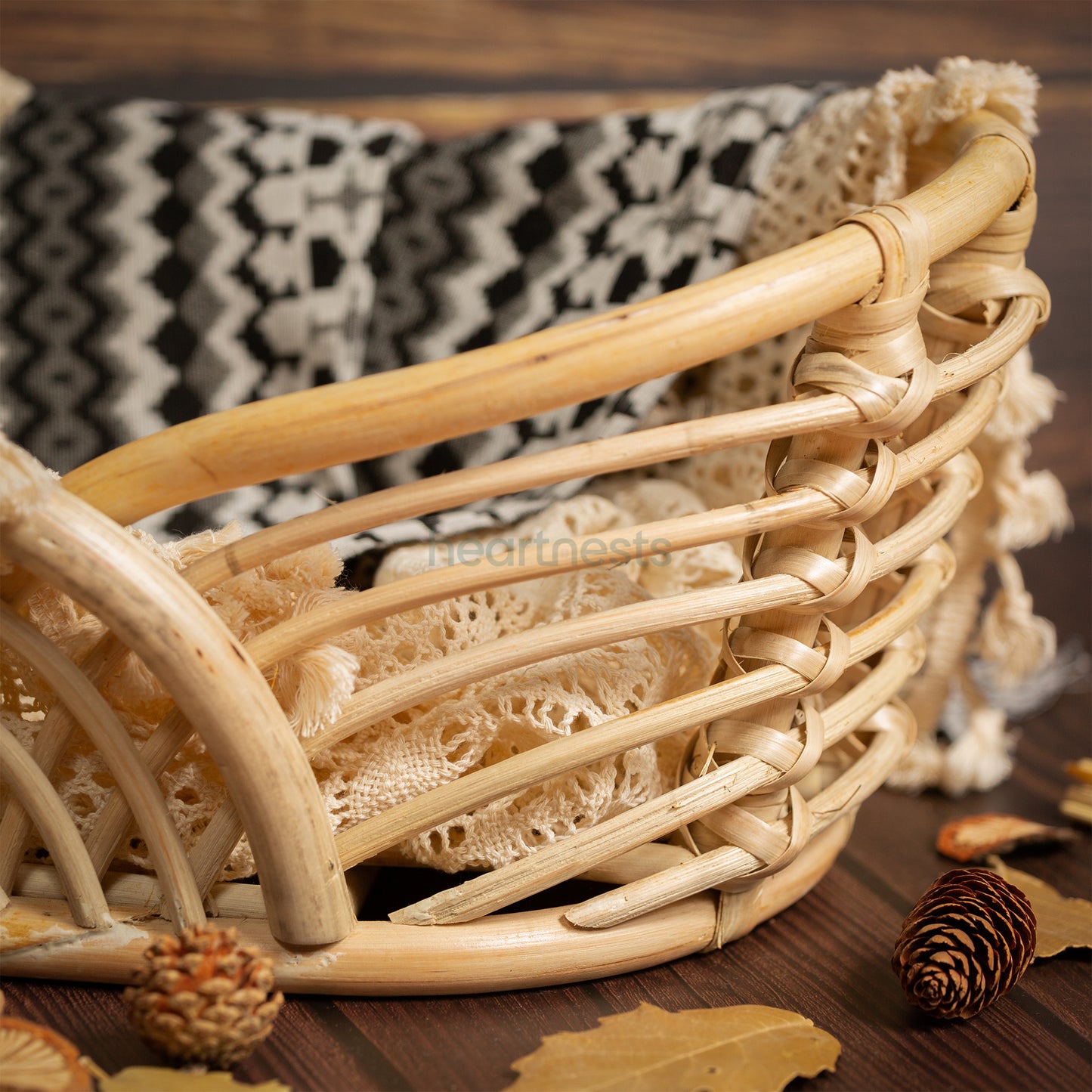 A part of a Heartnests's Noah Rattan Baby Prop is seen in  a close view