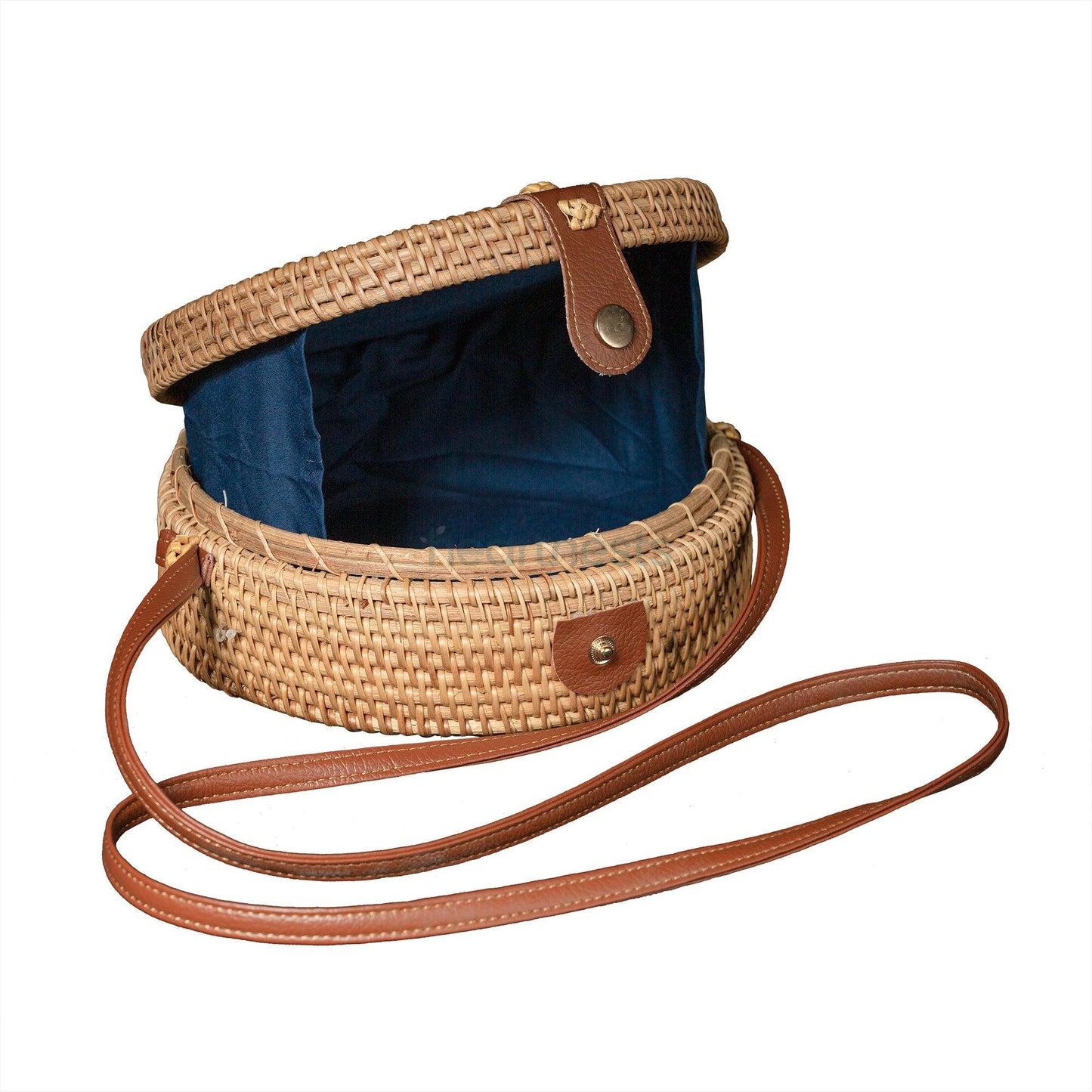 Heartnests' Rosie Rattan Crossbody bag is opened showing the blue fabric line inside