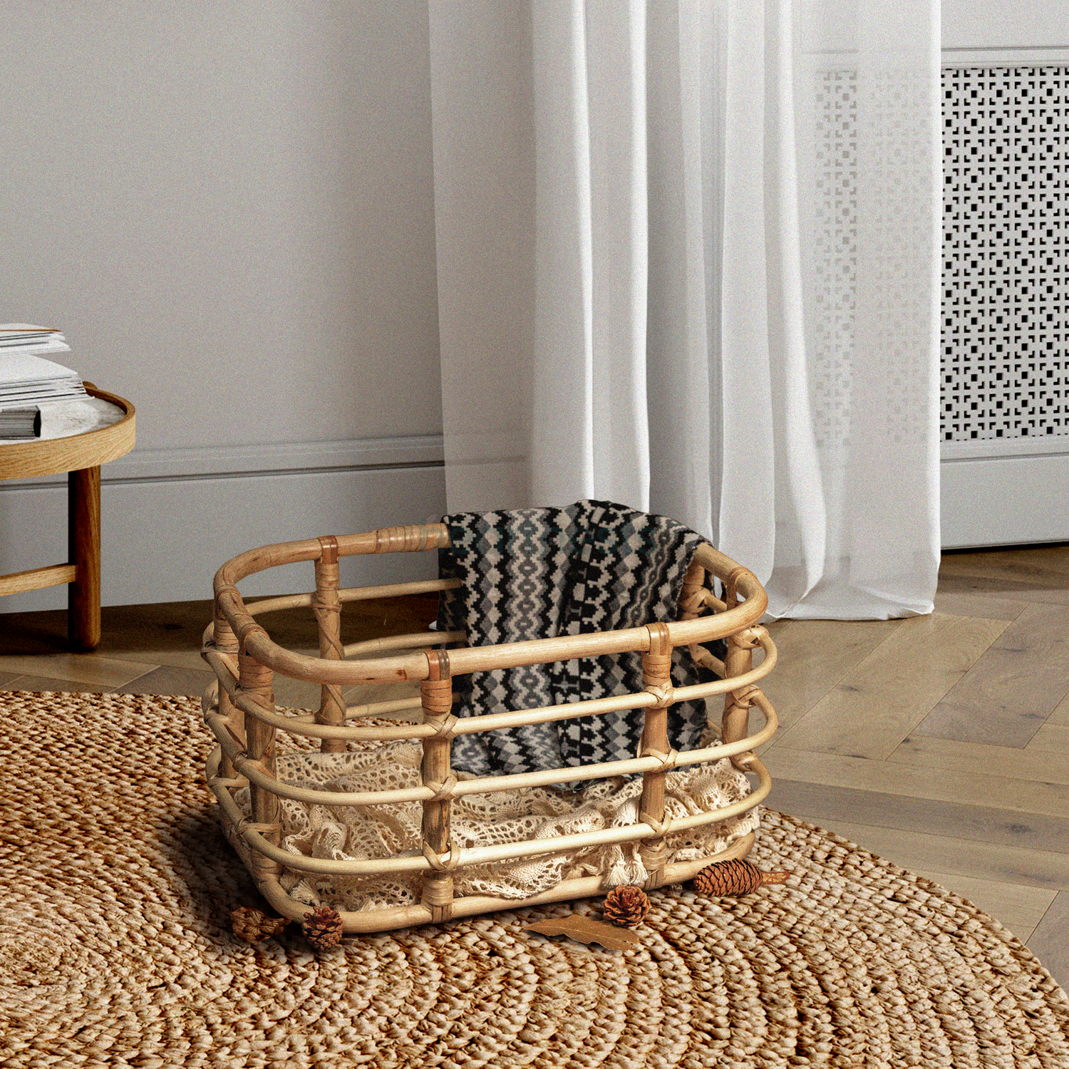 Heartnests' Peony Rattan Baby Photography is on a rattan rug on a wooden floor