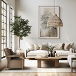 A Heartnests' Lombok Jute Pendant Light is hung above a 3 seater sandy color sofa with matching cushions and a wooden round table and 2 wooden armchairs placed next to a green indoor tree in a Wabi Sabi style living room