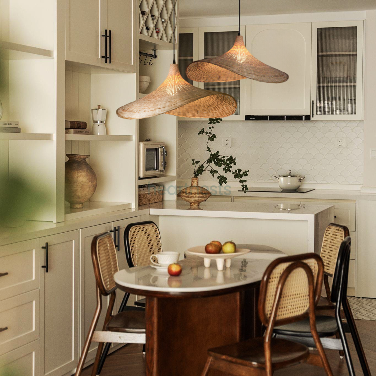 2 of Heartnests' Mexica Rattan Pendant Lights are hung above a rectangular  dining table and 4 rattan chairs in a minimalistic small kitchen area