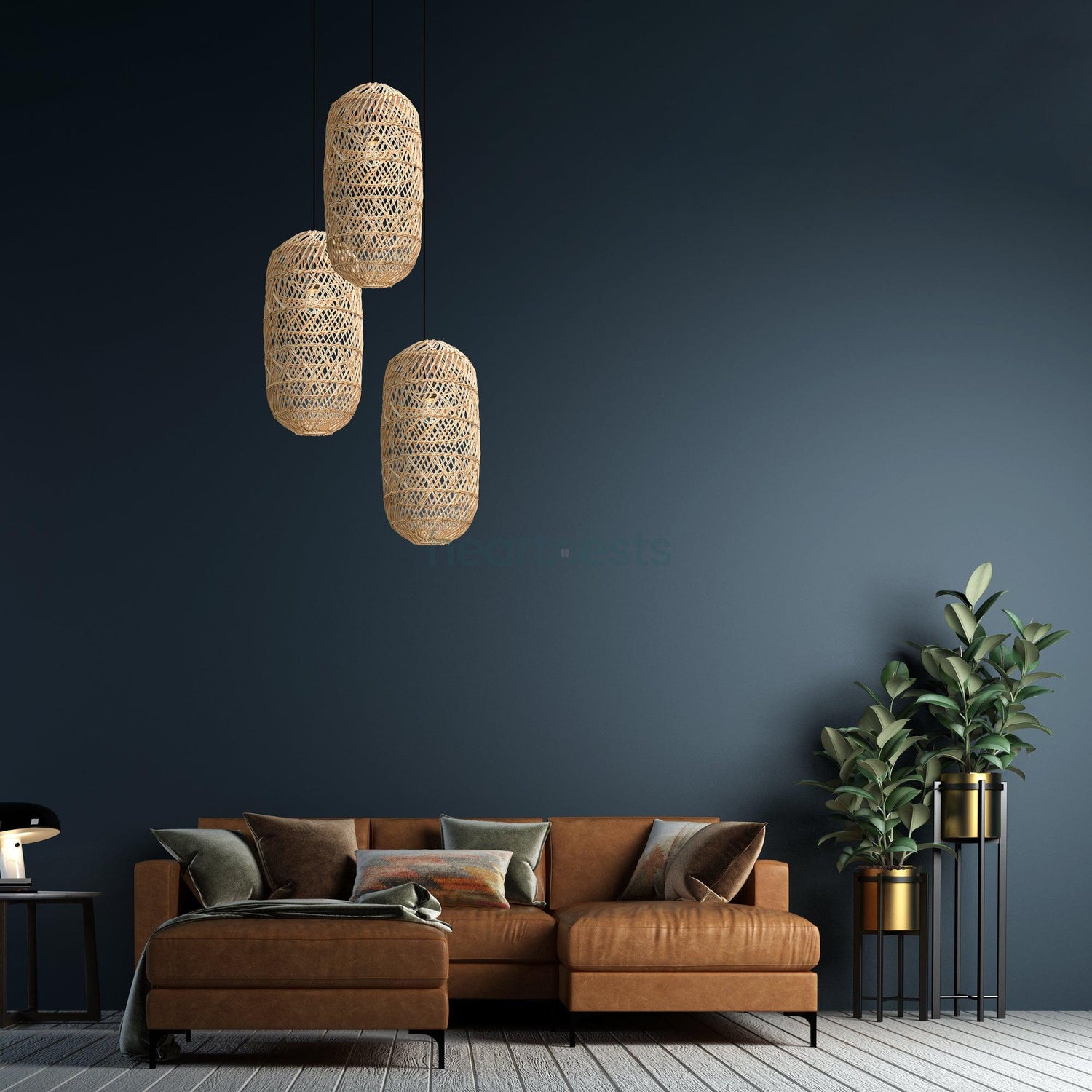 3 of Heartnests' Moreton Rattan Hanging Lights are hung above a brown colour leather couch which is next to a green tree pot plant in a mid century style living room with blue hue colour wall