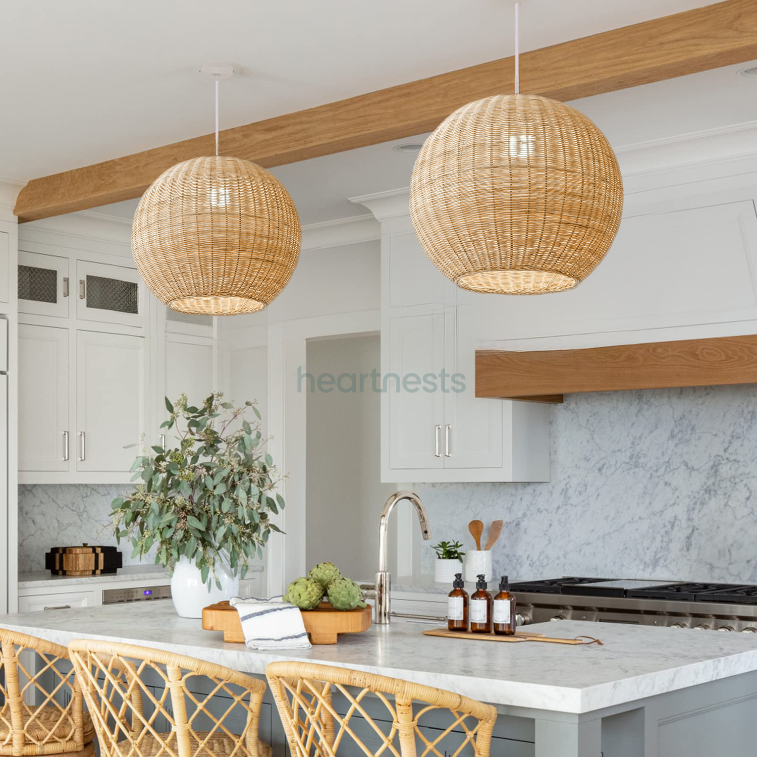 2 of Heartnests' Preethy Rattan Hanging Lights are hung side by side over a kitchen island and rattan chairs in a minimalistic kitchen  